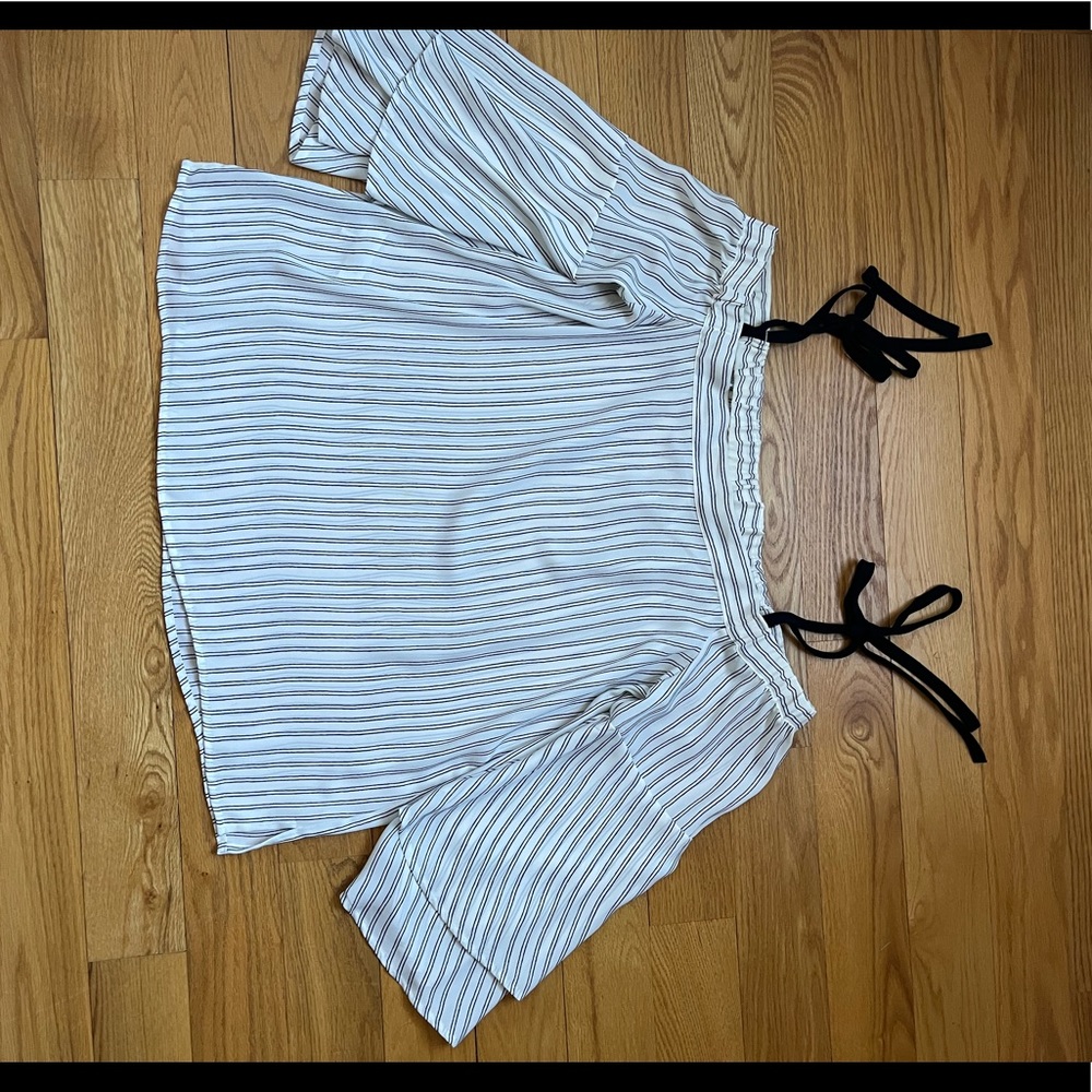 White and black stipe with black tie shoulder and flutter sleeves.